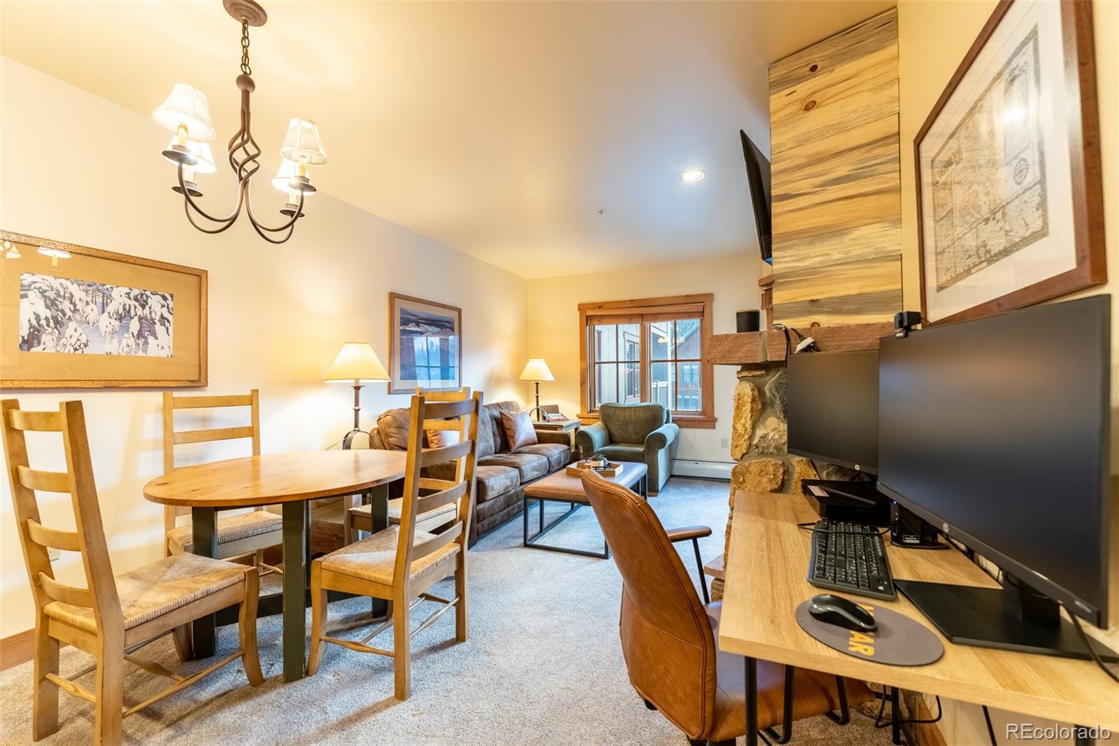 135 Dercum Drive, Unit 8595 Keystone, CO 80435 - Photo 7 of 33 a view of a dining room with furniture a chandelier and wooden floor