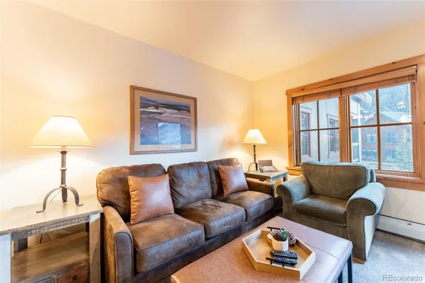 a living room with furniture and a large window