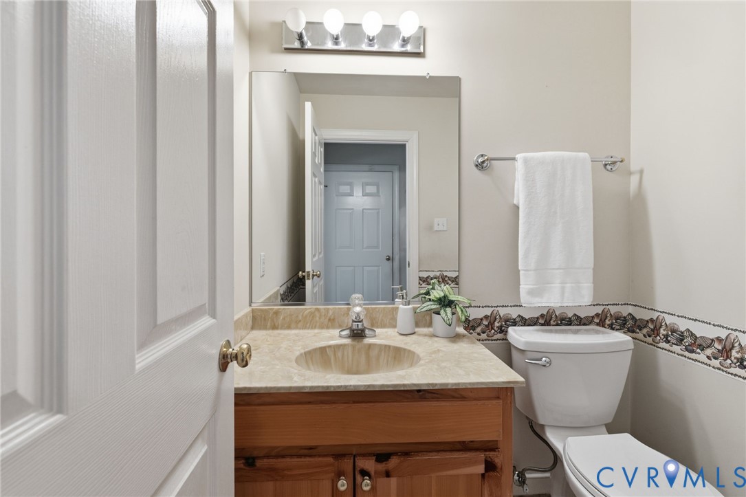2615 Salisbury Road Midlothian, VA 23113 - Photo 17 of 36 a bathroom with a sink and a mirror