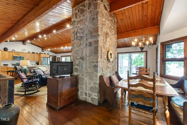 a bedroom with two beds and a large window