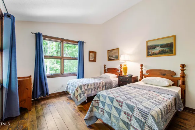 a living room with furniture and a gym machine