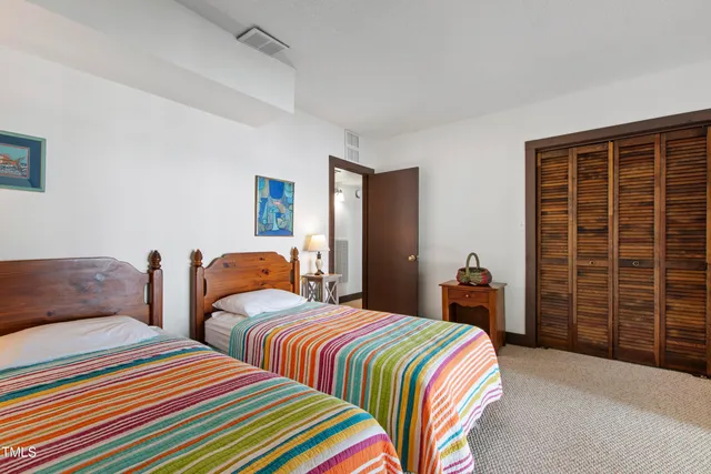 a view of a chairs and table on the wooden deck