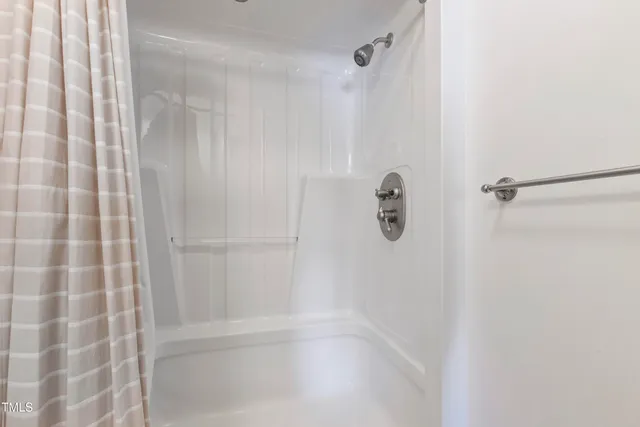 a view of balcony with wooden floor and fence