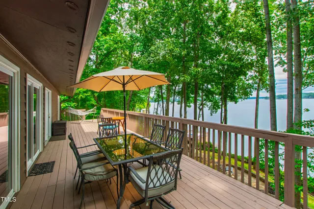 a view of walk in closet and wooden door