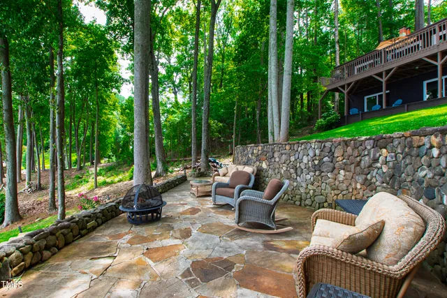 an aerial view of a houses with outdoor space and lake view