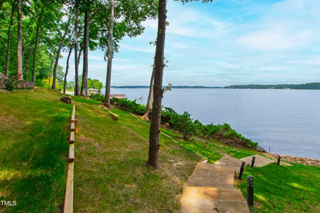 an aerial view of a houses with ocean view