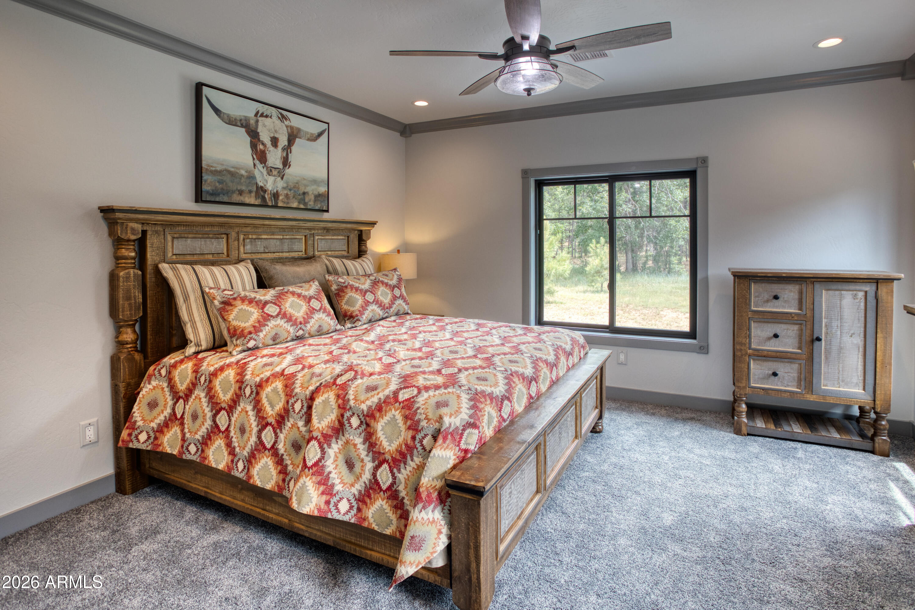 2281 West Edgewater Show Low, AZ 85901 - Photo 22 of 46 a bed sitting in a spacious bedroom next to a window