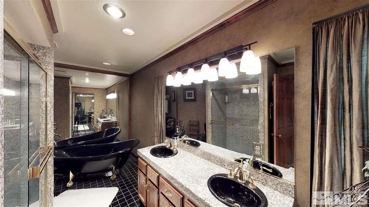 169 Chimney Rock Road Stateline, NV 89449 - Photo 14 of 25 a bathroom with a sink a toilet and a mirror