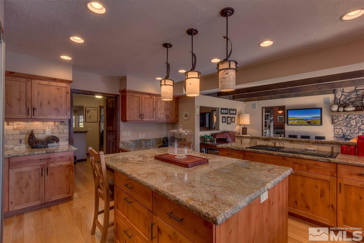 169 Chimney Rock Road Stateline, NV 89449 - Photo 3 of 25 a kitchen with kitchen island a counter top space a sink stainless steel appliances and cabinets