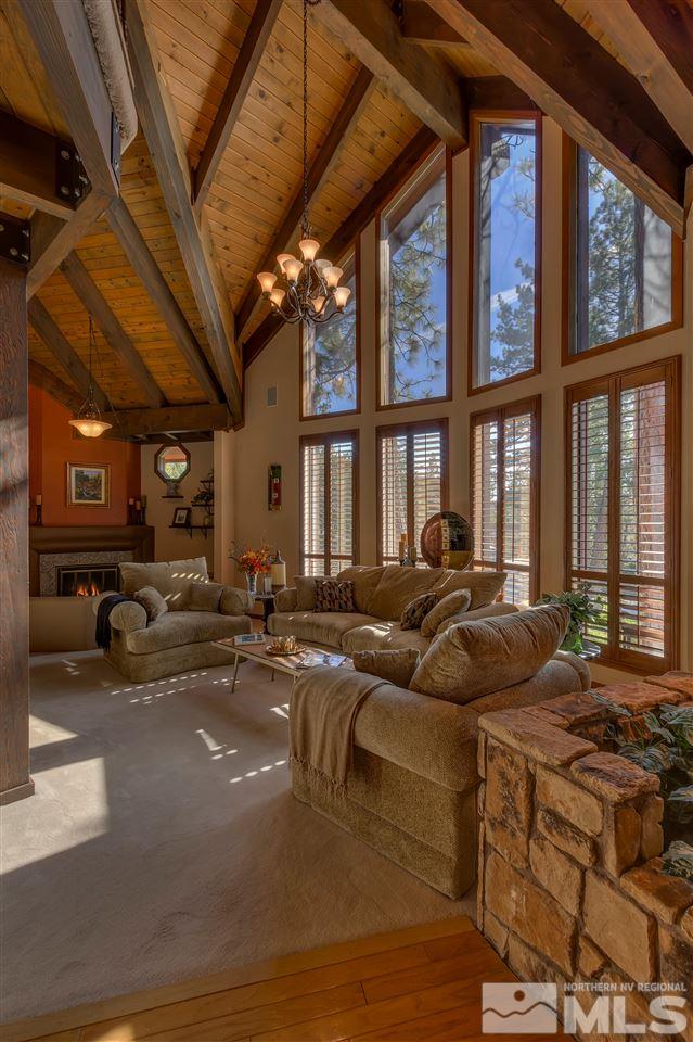 169 Chimney Rock Road Stateline, NV 89449 - Photo 4 of 25 a living room with furniture fireplace and large windows