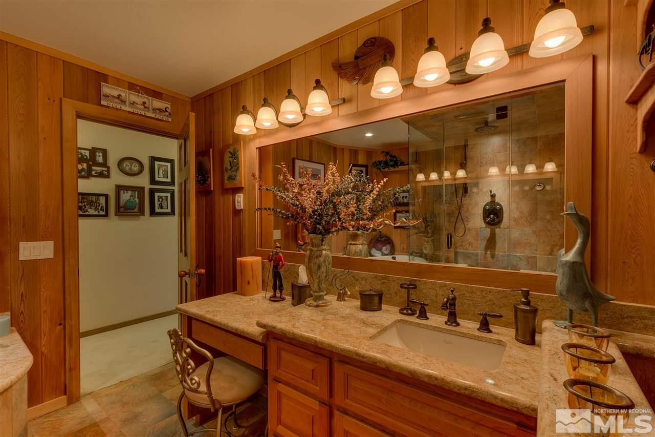 169 Chimney Rock Road Stateline, NV 89449 - Photo 8 of 25 a bathroom with a sink and a mirror
