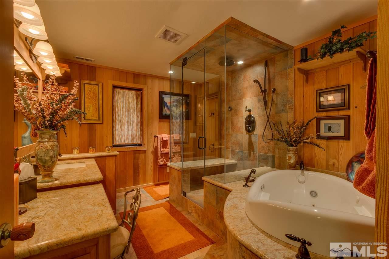 169 Chimney Rock Road Stateline, NV 89449 - Photo 9 of 25 a bathroom with a tub and shower