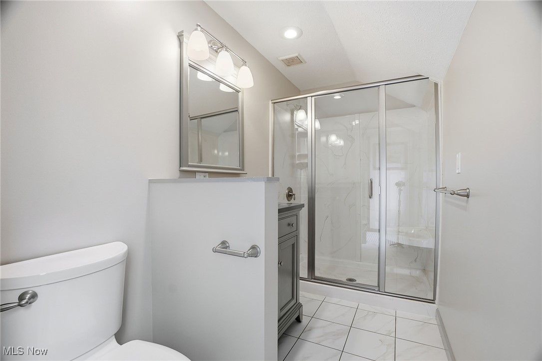 11710 Butternut Road Chardon, OH 44024 - Photo 29 of 48 Bathroom featuring vanity, a marble finish shower, and light marble finish floors