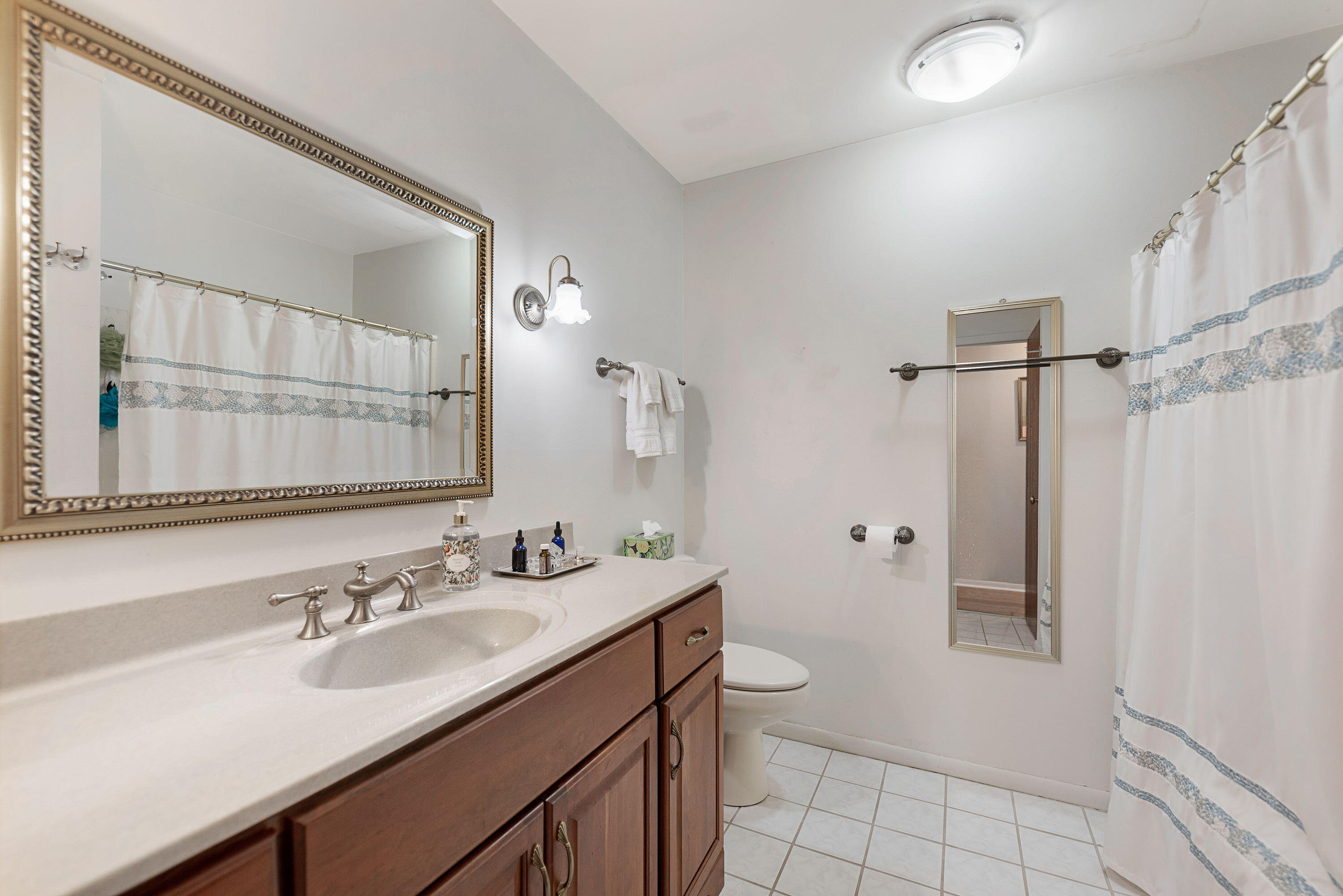 450 Old Stone Road, Unit 2 Munster, IN 46321 - Photo 12 of 16 a bathroom with a double vanity sink toilet and shower