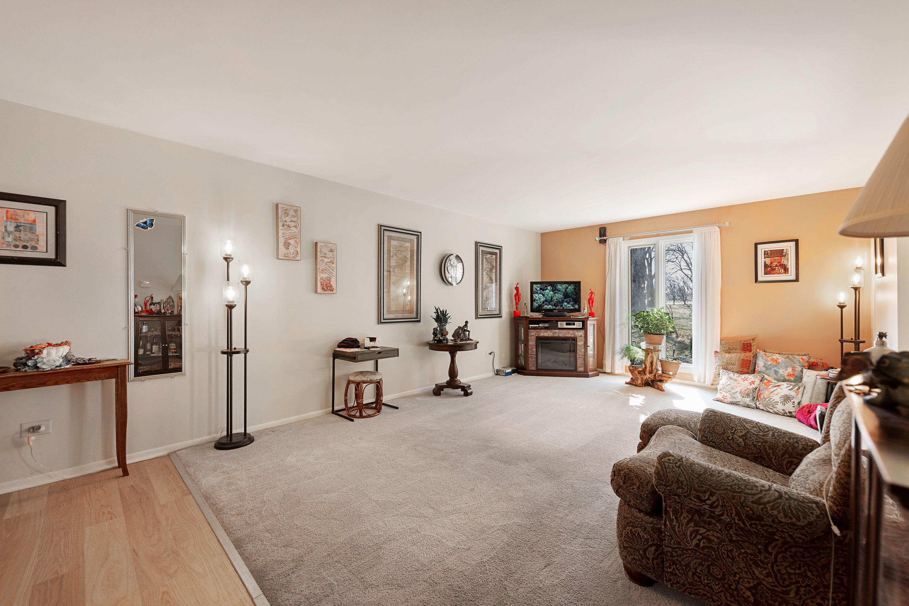 450 Old Stone Road, Unit 2 Munster, IN 46321 - Photo 5 of 16 a living room with furniture and a flat screen tv