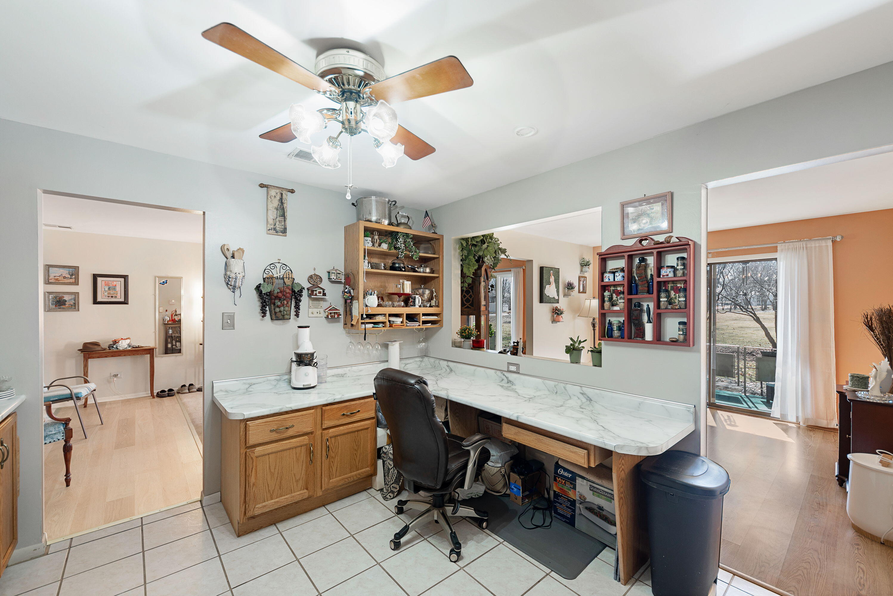 450 Old Stone Road, Unit 2 Munster, IN 46321 - Photo 7 of 16 a view of a dining room with furniture and a chandelier fan