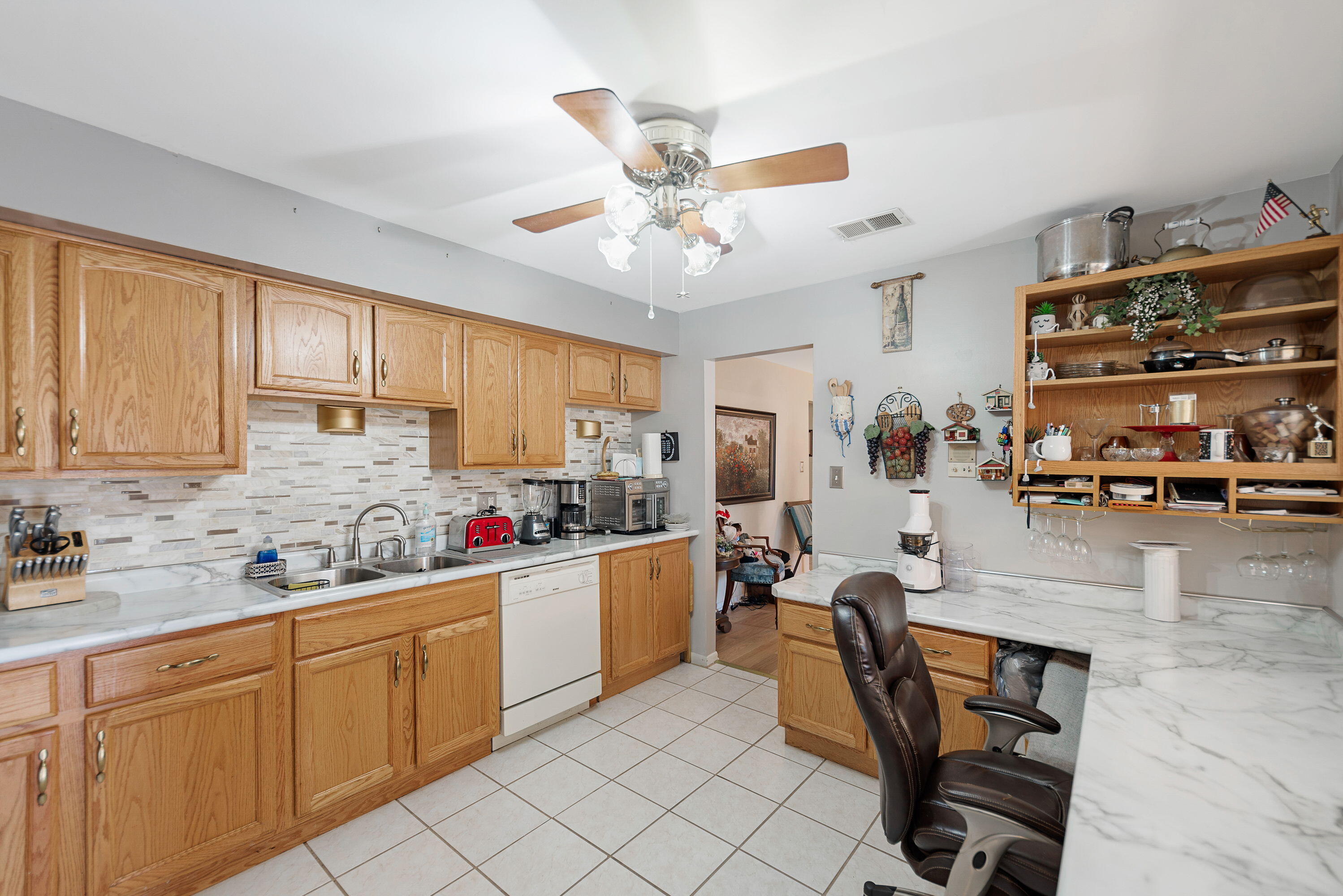 450 Old Stone Road, Unit 2 Munster, IN 46321 - Photo 8 of 16 a kitchen with a sink a stove and white cabinets