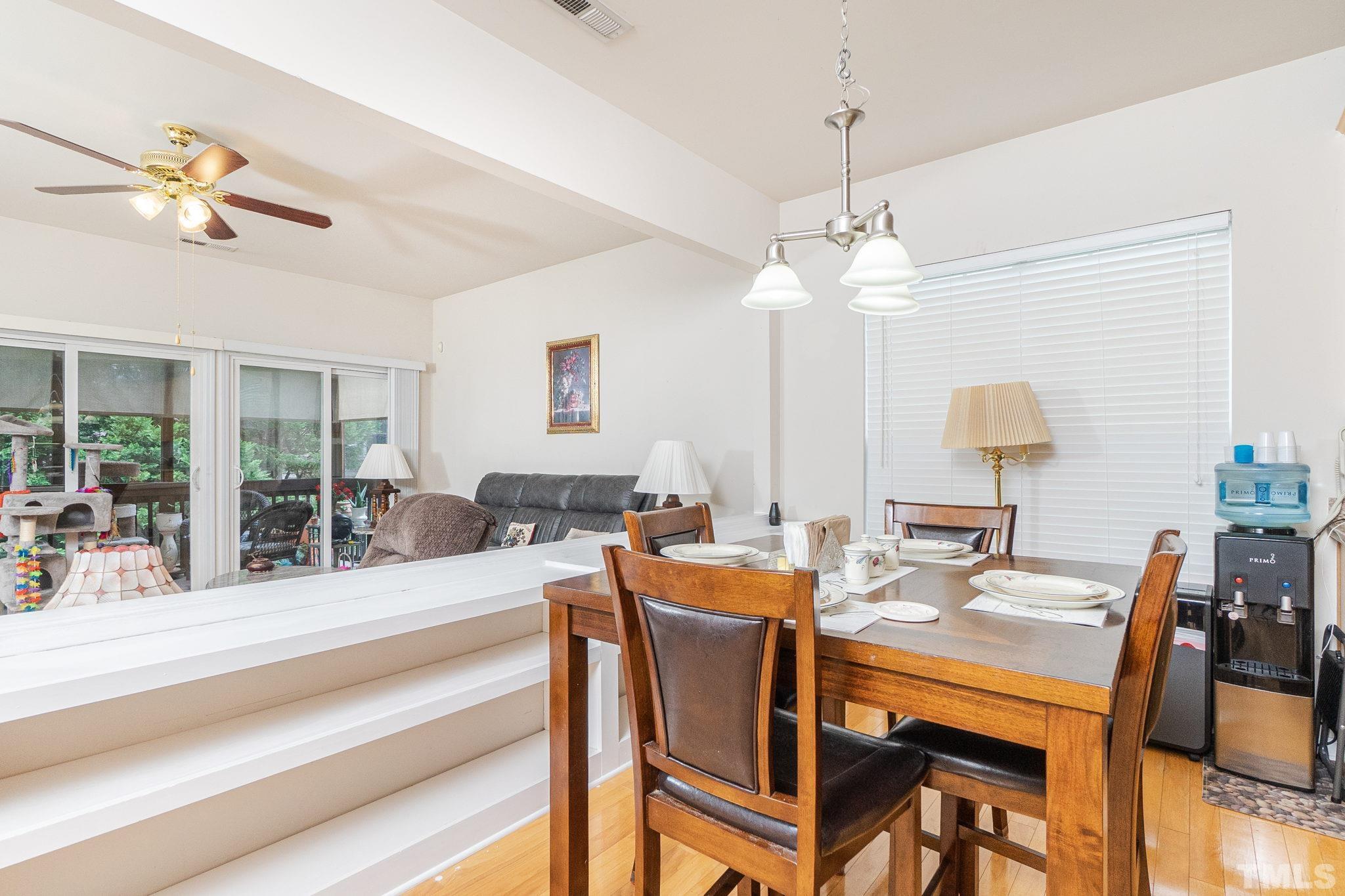3404 Secretariat Way Raleigh, NC 27614 - Photo 19 of 44 a view of a dining room with furniture window and wooden floor