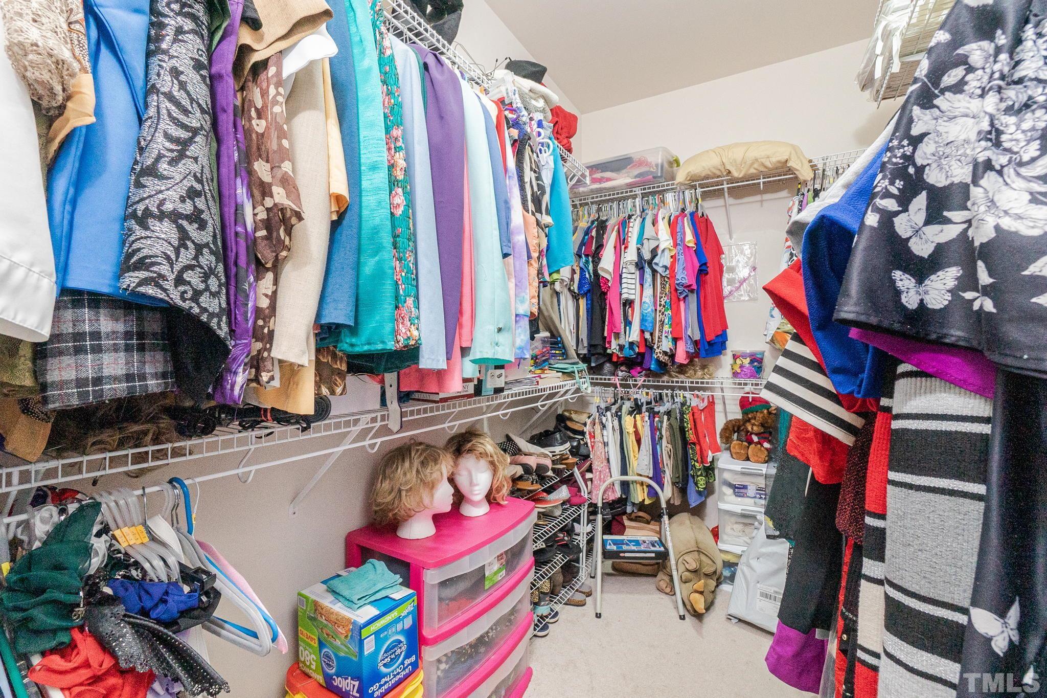 3404 Secretariat Way Raleigh, NC 27614 - Photo 30 of 44 a view of walk in closet with clothes
