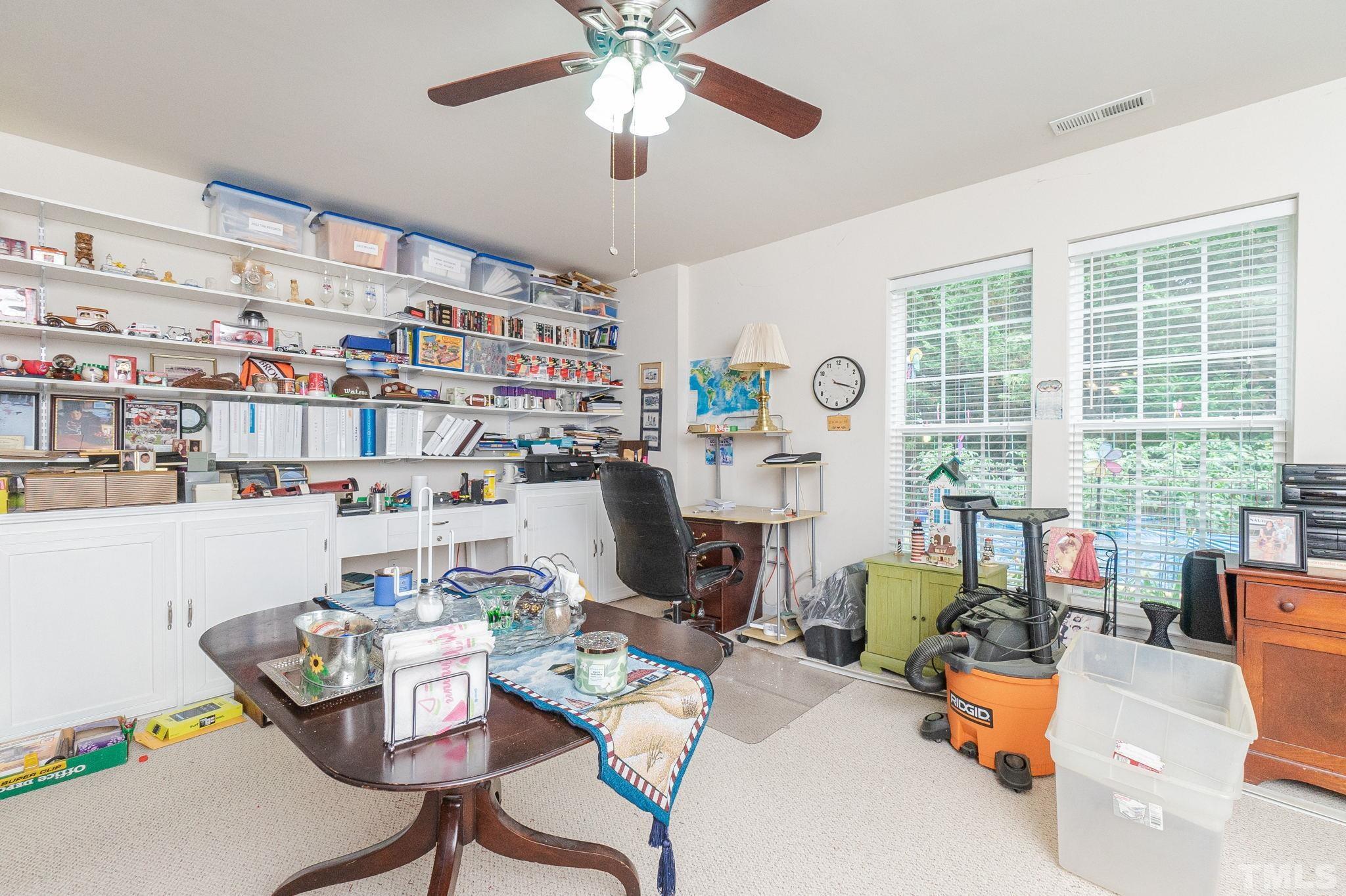 3404 Secretariat Way Raleigh, NC 27614 - Photo 35 of 44 a work room with furniture and a large window
