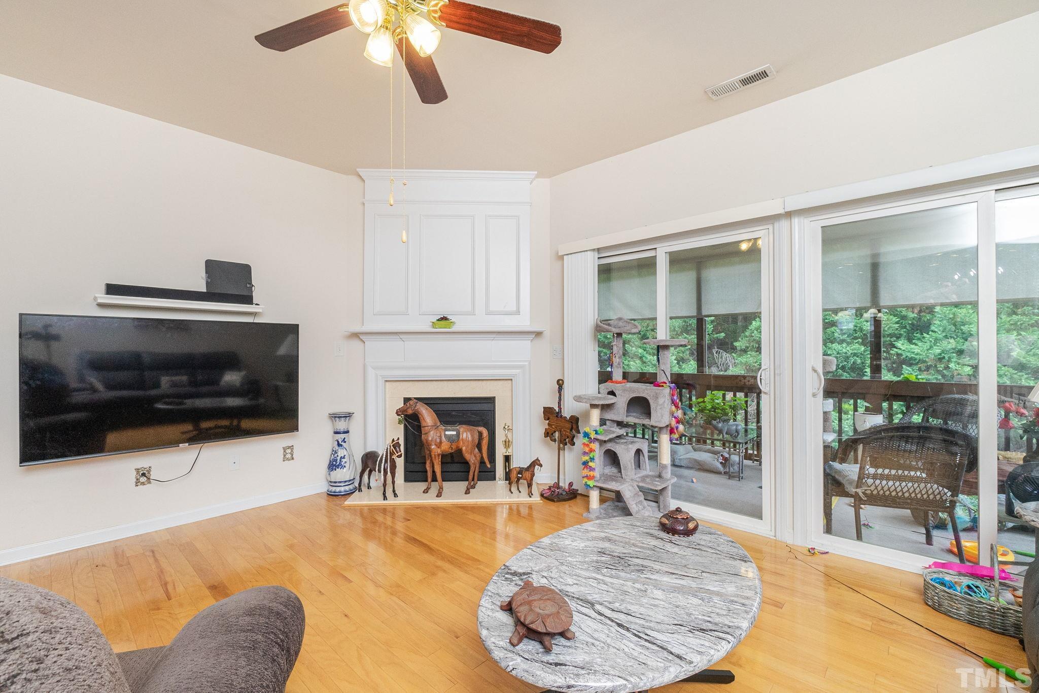 3404 Secretariat Way Raleigh, NC 27614 - Photo 9 of 44 a living room with furniture and a flat screen tv
