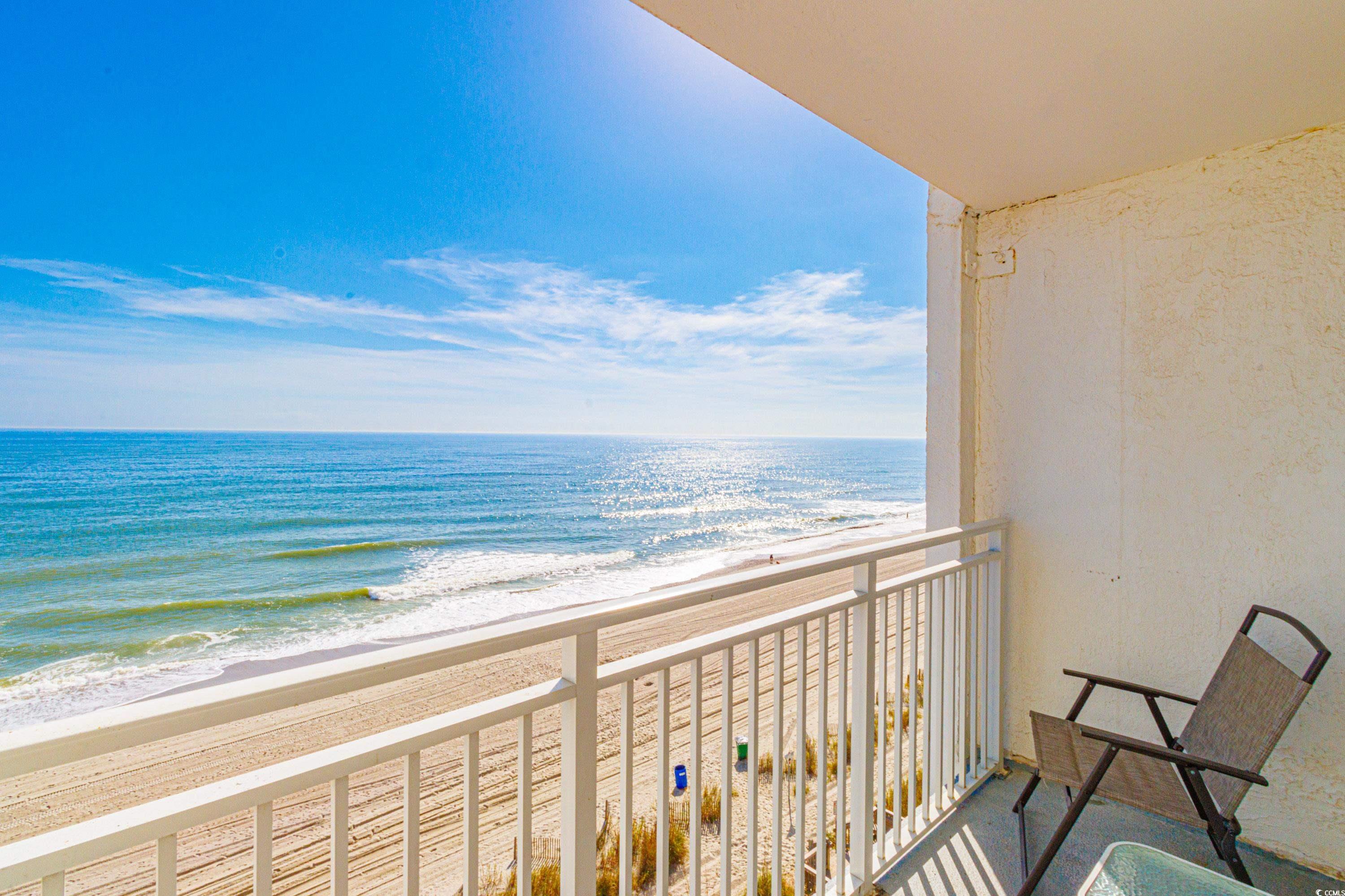 1207 South Ocean Boulevard, Unit 20703 Myrtle Beach, SC 29577 - Photo 2 of 22 Balcony featuring a water view and a beach view