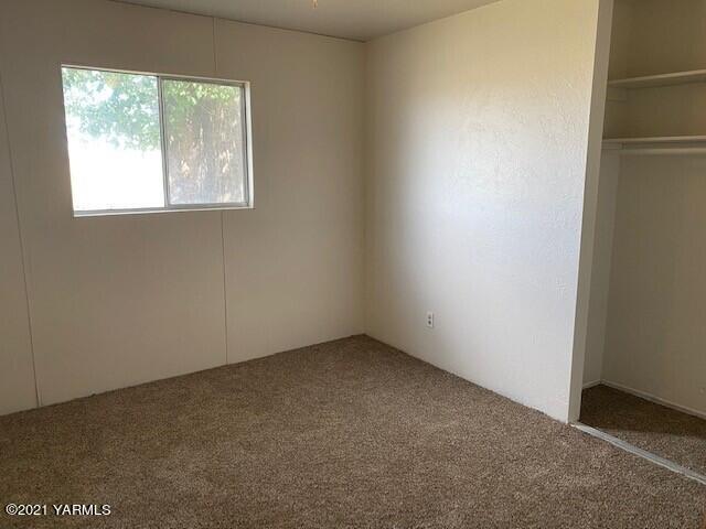 320 Lower County Line Road Prosser, WA 99350 - Photo 11 of 14 an empty room with a window