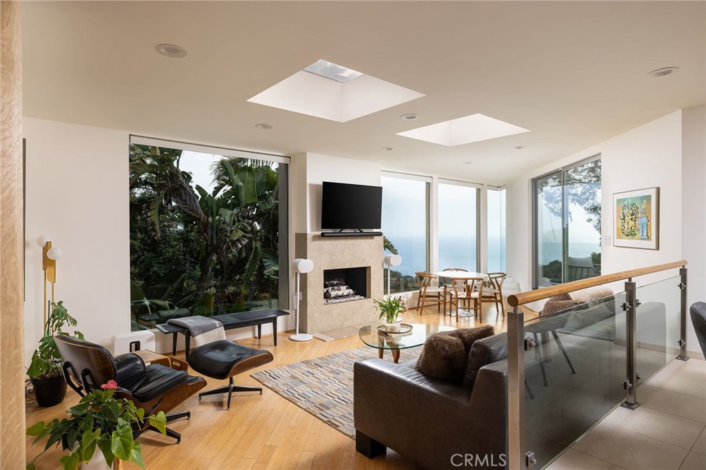 865 Balboa Avenue Laguna Beach, CA 92651 - Photo 1 of 60 a living room with fireplace furniture and a large window