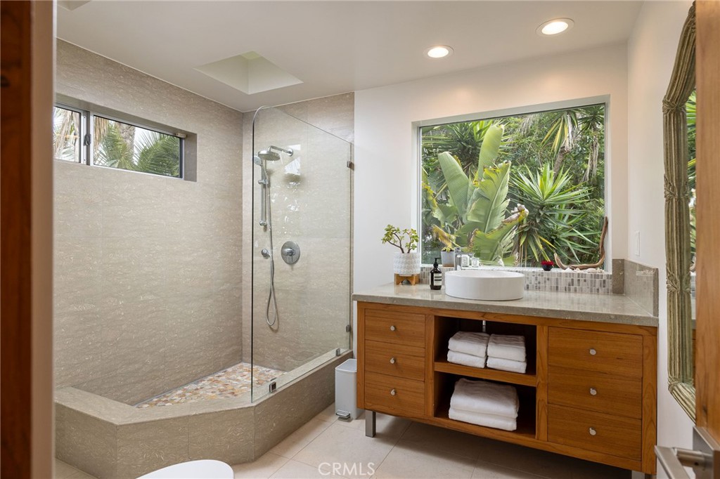 865 Balboa Avenue Laguna Beach, CA 92651 - Photo 11 of 60 a bathroom with a tub and a sink