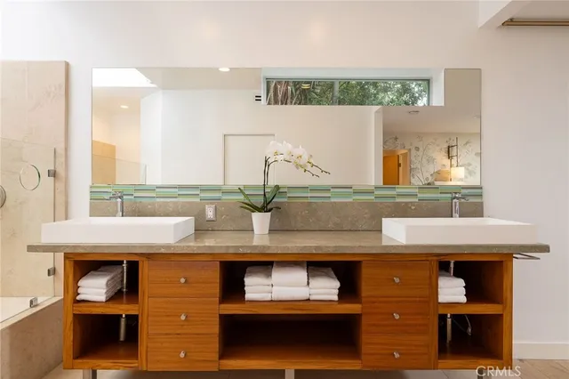 a bedroom with a bed and a chair