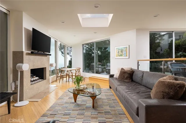 a living room with fireplace furniture and a flat screen tv