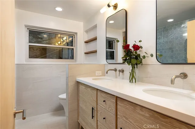 a bedroom with a bed and glass door