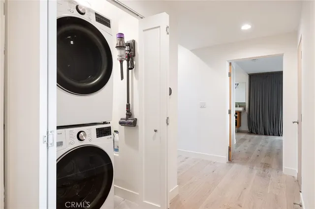 a view of a roof deck with couches and sky view