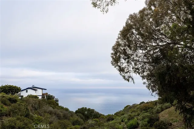 a view of a balcony dining table and chairs