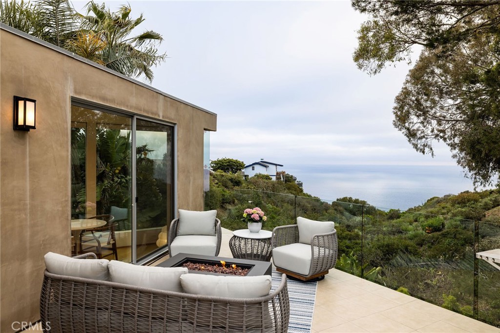 865 Balboa Avenue Laguna Beach, CA 92651 - Photo 28 of 60 a view of a roof deck with couches and sky view