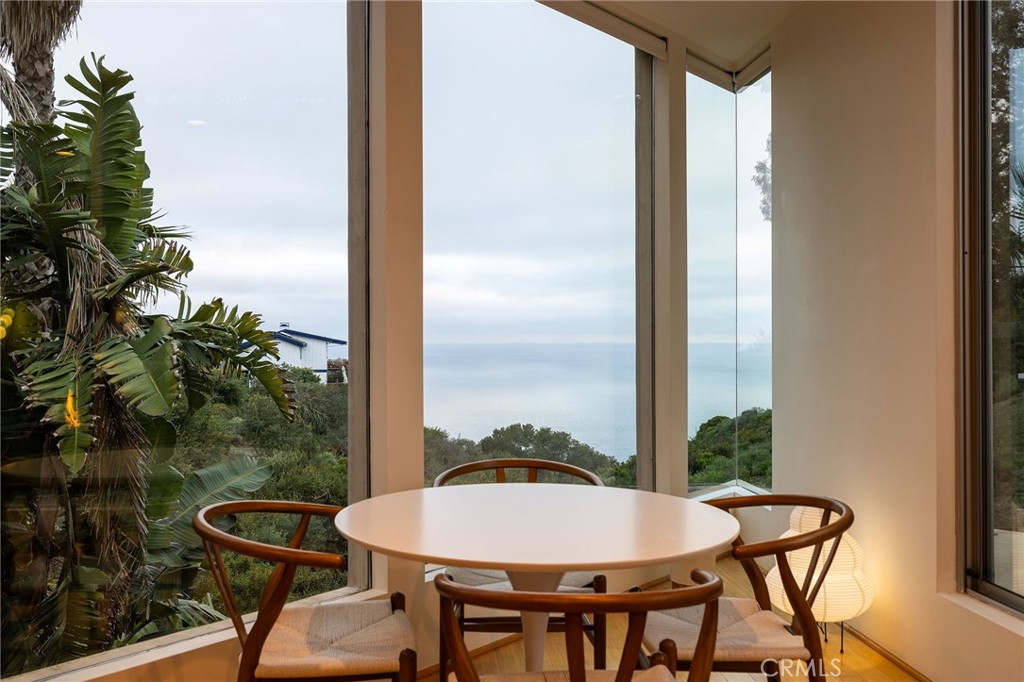 865 Balboa Avenue Laguna Beach, CA 92651 - Photo 30 of 60 a view of a balcony dining table and chairs