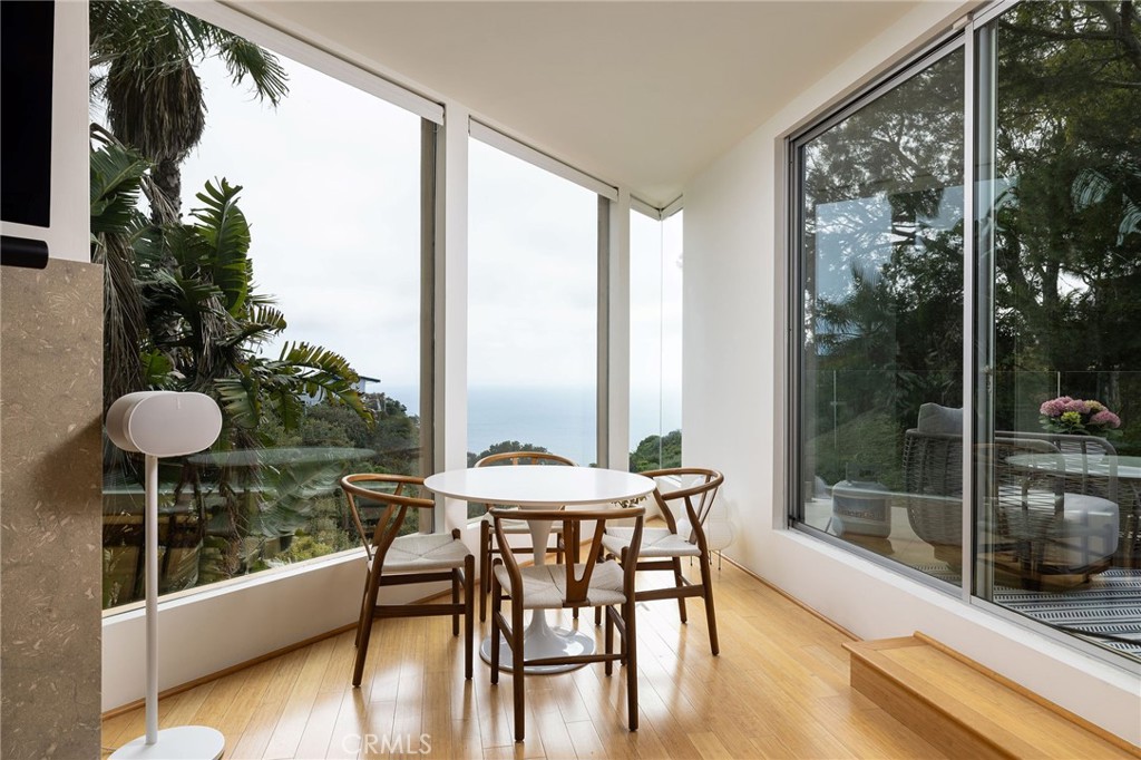 865 Balboa Avenue Laguna Beach, CA 92651 - Photo 3 of 60 a dining room with furniture and wooden floor