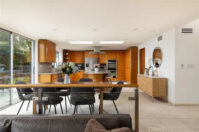 a view of a dining room with furniture window and outside view