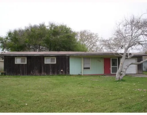 a house view with a garden space