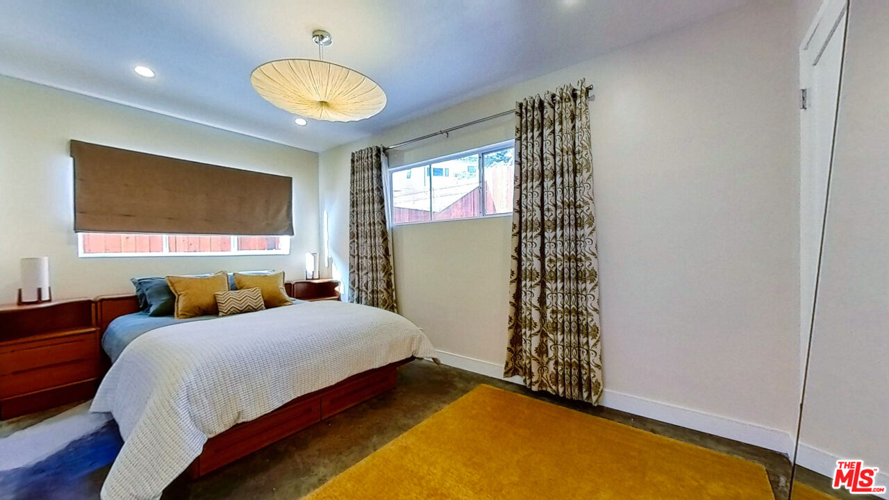 1237 Montecito Drive Los Angeles, CA 90031 - Photo 12 of 26 a bedroom with a bed and a window