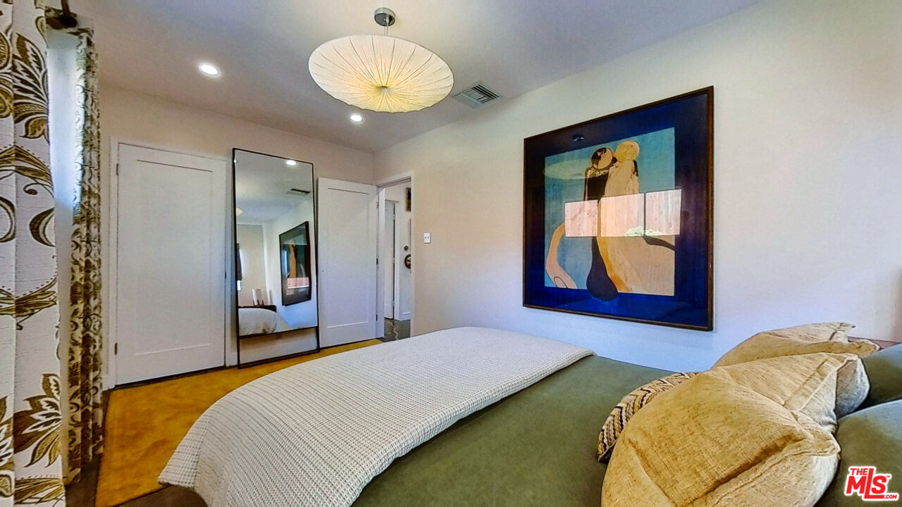 1237 Montecito Drive Los Angeles, CA 90031 - Photo 13 of 26 a bedroom with bed and a large mirror
