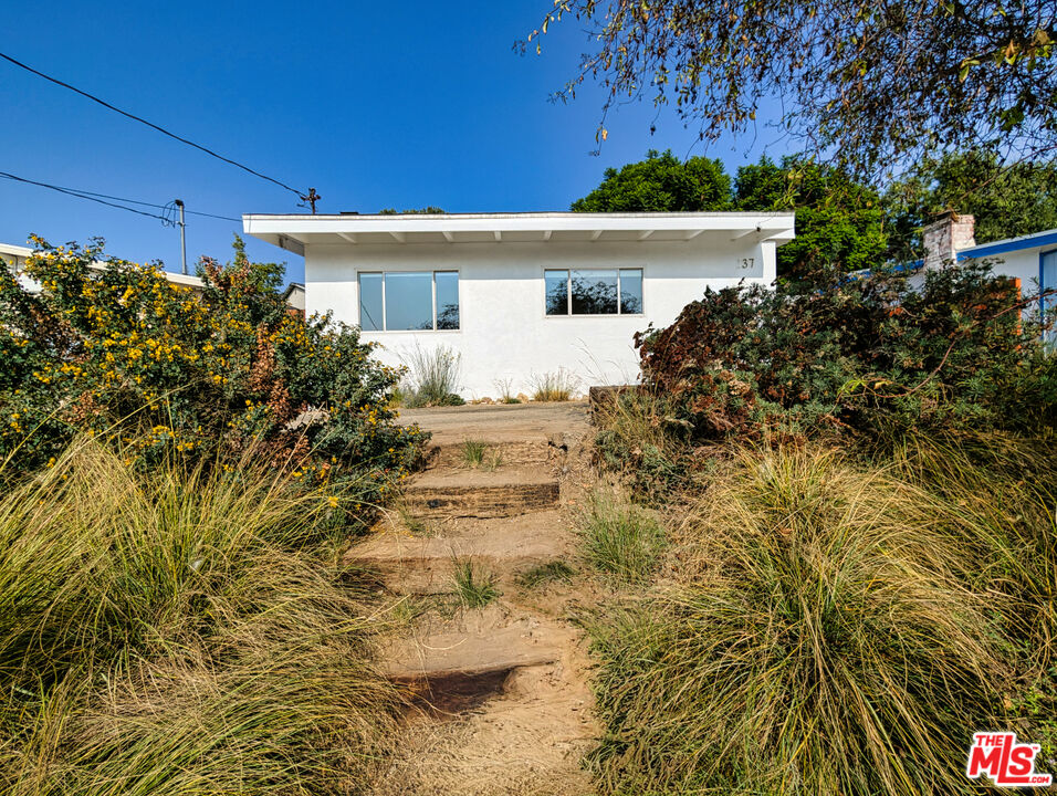 1237 Montecito Drive Los Angeles, CA 90031 - Photo 19 of 26 a view of a house with a yard