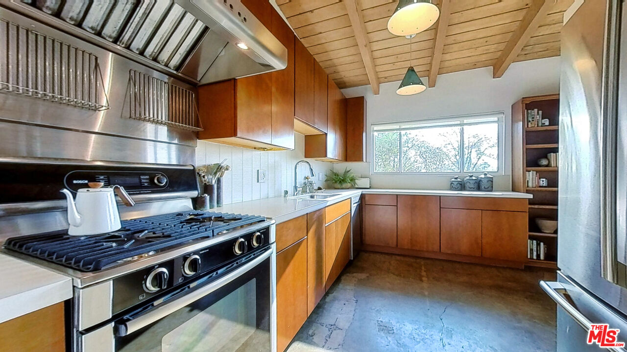 1237 Montecito Drive Los Angeles, CA 90031 - Photo 5 of 26 a kitchen with stainless steel appliances granite countertop a stove and a sink