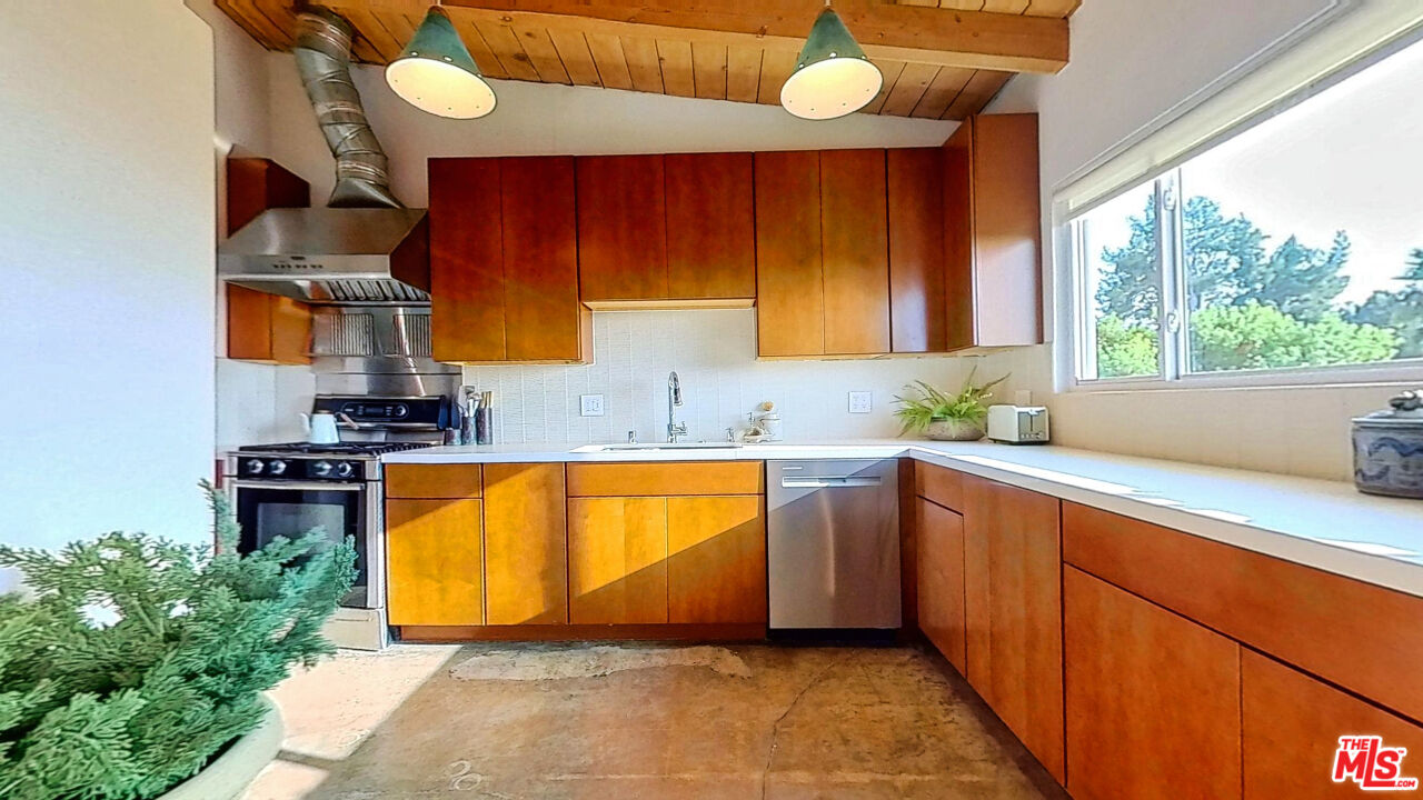 1237 Montecito Drive Los Angeles, CA 90031 - Photo 6 of 26 a room with cabinets and window