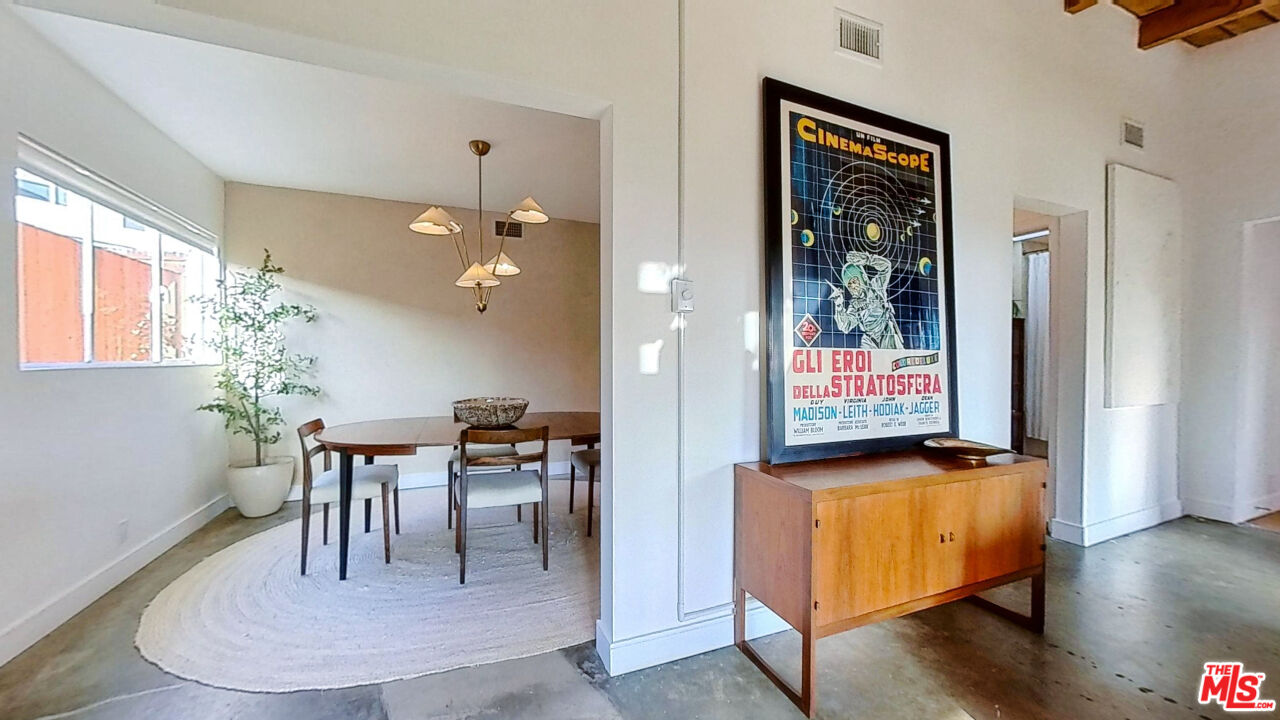 1237 Montecito Drive Los Angeles, CA 90031 - Photo 7 of 26 a dining room with wooden floor table and chairs