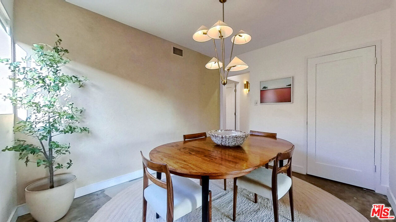 1237 Montecito Drive Los Angeles, CA 90031 - Photo 8 of 26 a view of a dining room with furniture and wooden floor