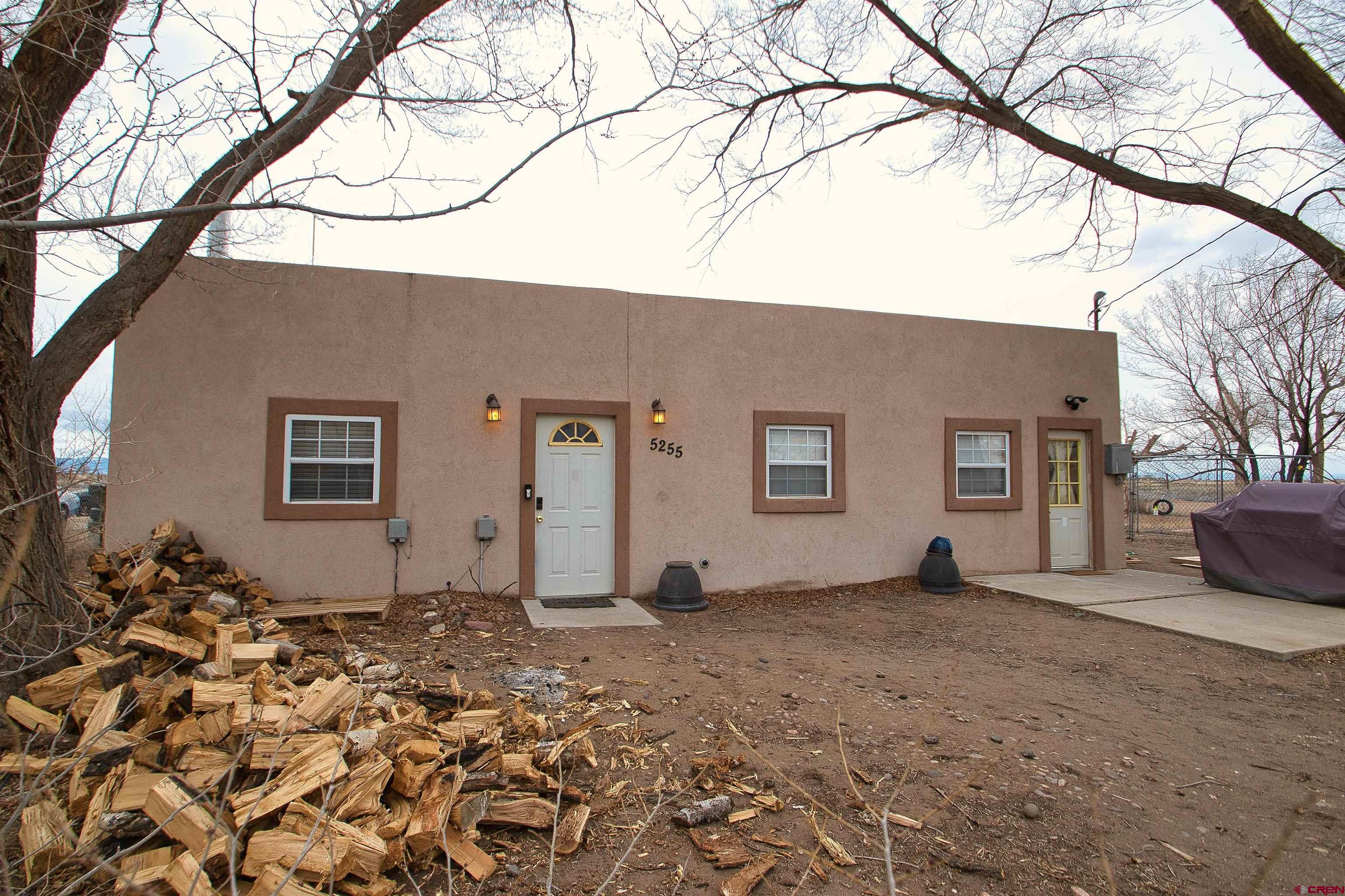 5255 Oviatt Street Mosca, CO 81146 - Photo 1 of 10 a view of a house with a snow in the yard
