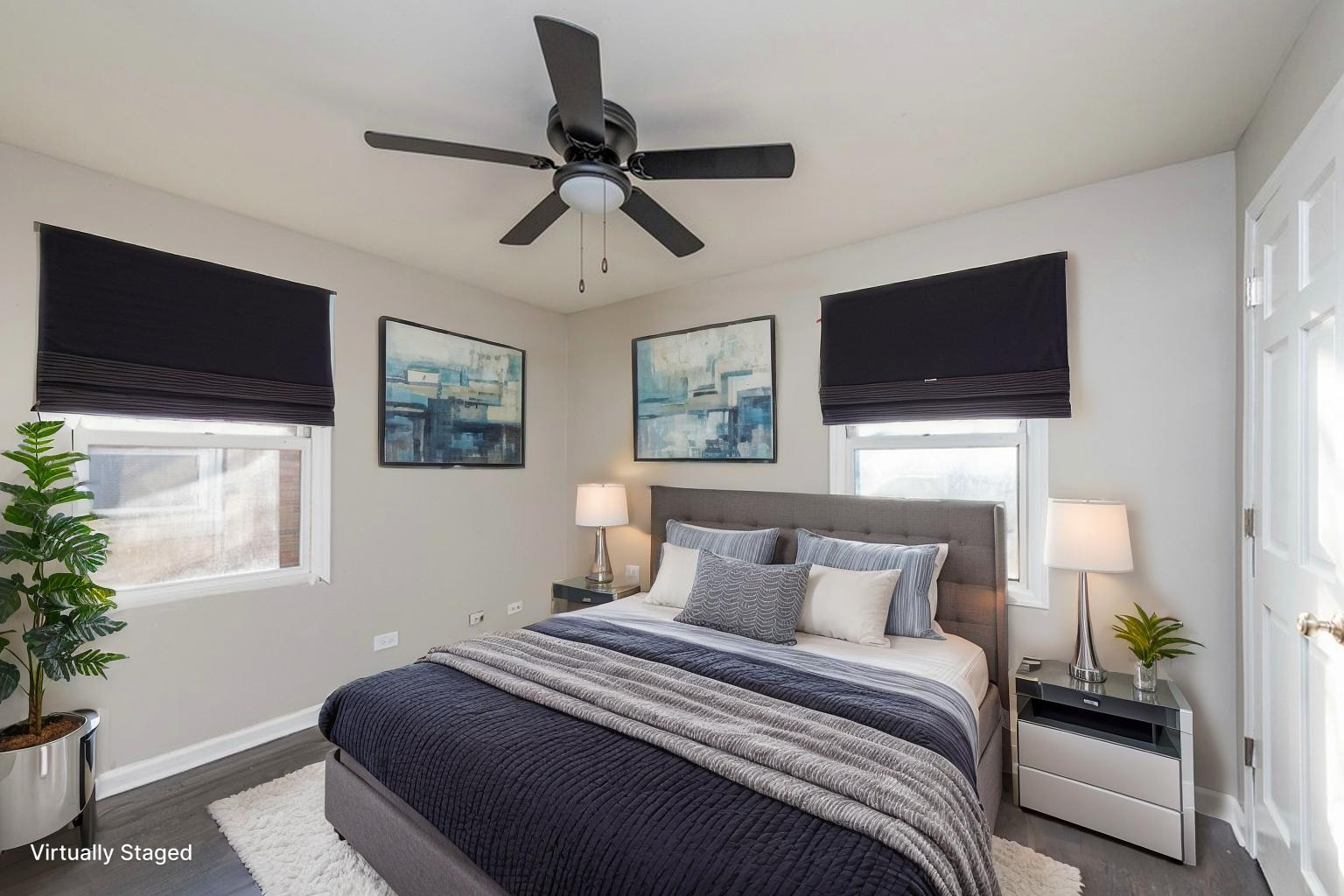 821 12th Street North Chicago, IL 60064 - Photo 18 of 25 a bedroom with a bed and a flat screen tv