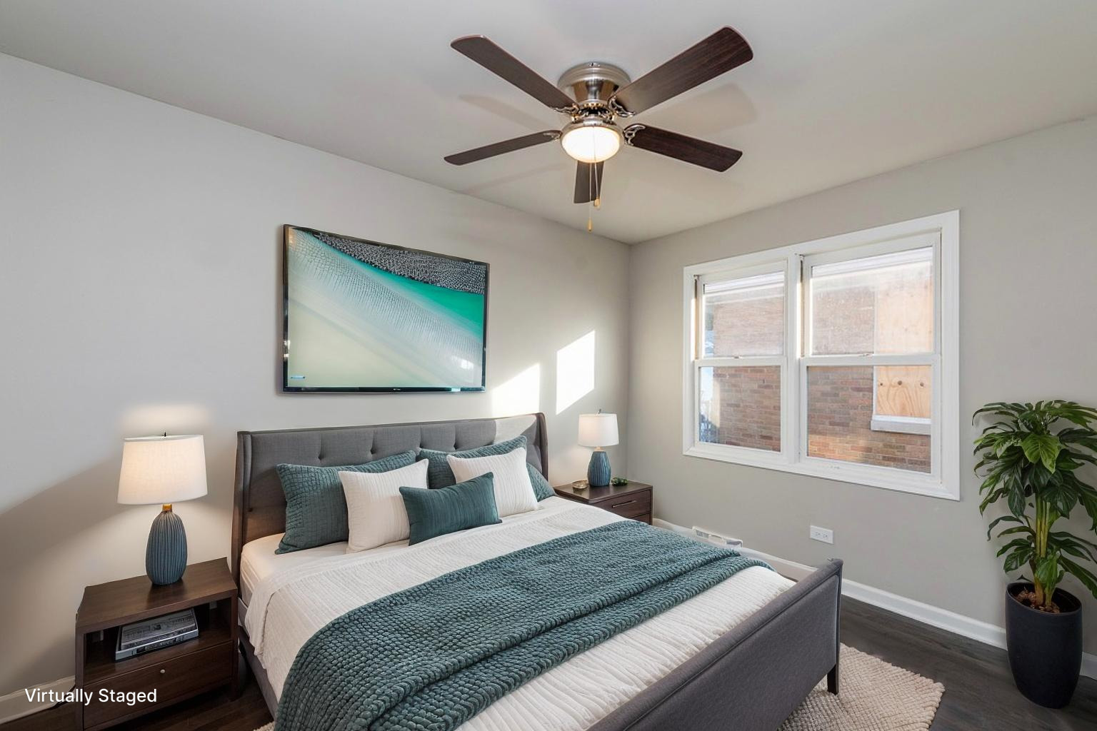 821 12th Street North Chicago, IL 60064 - Photo 19 of 25 a bedroom with a large bed and a chandelier