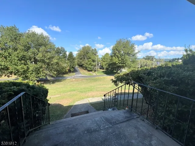 a view of a swimming pool with a lake view